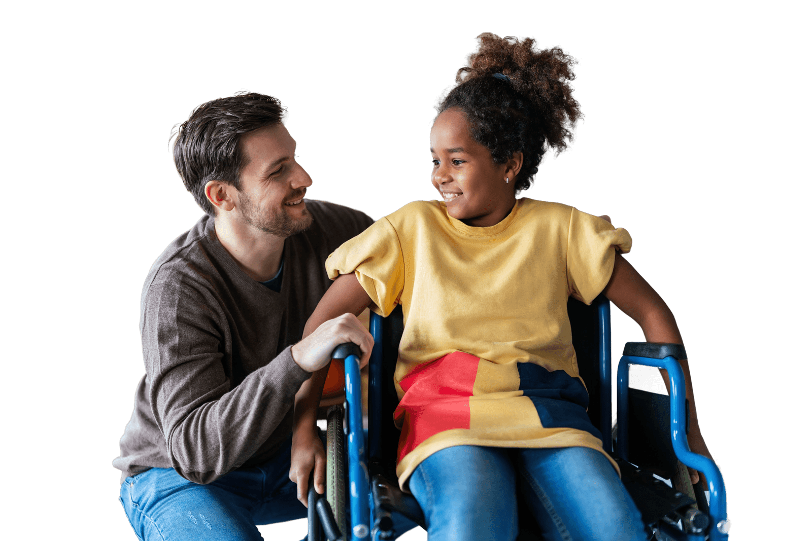 A support worker and a smiling young person in a wheelchair sharing a moment together
